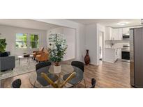 Open concept living and dining area with hardwood floors and plenty of natural light at , Atlanta, GA 30354