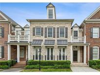 Charming brick townhome featuring black shutters and a manicured front yard at 3585 Roxboro Ne Rd # 2, Atlanta, GA 30326