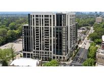 Stunning high-rise building boasts modern architecture, expansive windows, and city views at 2425 Peachtree Ne Rd # 902, Atlanta, GA 30305