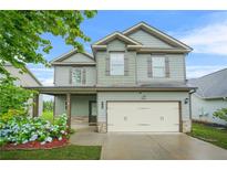 Charming two-story home with a two-car garage, inviting covered porch, and well-manicured lawn at 2166 Villa Spring Ct, Dacula, GA 30019