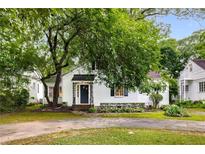 Charming one-story home with a manicured front yard and mature trees providing shade and curb appeal at 1981 N Decatur Ne Rd, Atlanta, GA 30307