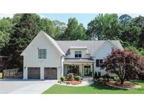 Stunning two-story modern farmhouse with a two-car garage and beautifully landscaped front yard at 2756 Octavia Ln, Marietta, GA 30062