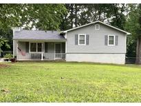 Charming single-Gathering home with a cozy front porch and well-maintained lawn at 5610 N Allen Rd, Mableton, GA 30126