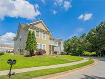 Inviting two-story home with a well-manicured lawn and charming exterior details, perfect for suburban living at 4567 Parkway Cir, Atlanta, GA 30349