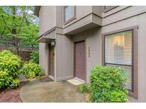Charming exterior view showcases inviting entrance and well-maintained landscaping at 1603 Cumberland Ct, Smyrna, GA 30080
