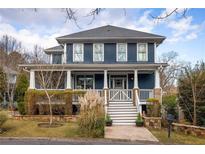 Charming two-story home with a welcoming front porch and well-maintained landscaping at 1602 Windsor Walk, Avondale Estates, GA 30002