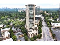 Stunning aerial view of a modern high-rise building in a bustling city, surrounded by lush greenery at 2881 Peachtree Ne Rd # 1202, Atlanta, GA 30305