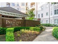 The Prescott at Park Place brick sign nestled among manicured landscaping, providing an appealing and professional community entrance at 11 Perimeter E Ctr # 1412, Atlanta, GA 30346