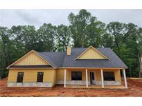 Inviting single-story home featuring a covered front porch and classic architectural details at 92 Jeffrey Ln, Dallas, GA 30157