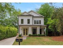 Charming two-story home with a manicured lawn, inviting curb appeal, and a welcoming front porch at 357 Mell Ave # A, Atlanta, GA 30307