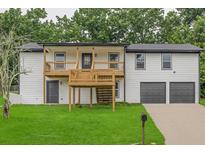 Charming two-story home featuring a spacious front yard, upper balcony, and a two car garage at 3233 Glynn Mill Dr, Snellville, GA 30039