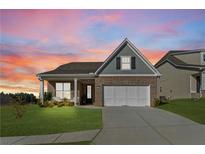 Beautiful single-Gathering home with a well-manicured lawn and an attached two-car garage at 48 Masters Dr, Villa Rica, GA 30180