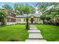 Charming single-story home with a well-manicured lawn and inviting walkway at 728 Antone Nw St, Atlanta, GA 30318