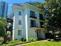 Charming multi-story home with black iron balconies and manicured front lawn in a desirable community at 1078 Piedmont Ne Ave # 206, Atlanta, GA 30309