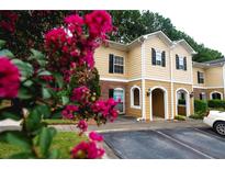 Inviting two-story home with well-maintained landscaping and a charming entrance at 122 Summer Pl, Norcross, GA 30071
