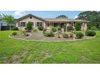 Charming brick home with a well-manicured front yard and inviting curb appeal at 2676 Abington Dr, Snellville, GA 30078