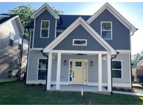 Charming two-story home with neutral siding, shingle accents, and a welcoming front porch at 3189 A Jackson, Hapeville, GA 30354