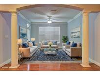 Bright living room with stylish furniture, hardwood floors, and a ceiling fan at 1203 Stratford Commons Commons, Decatur, GA 30030