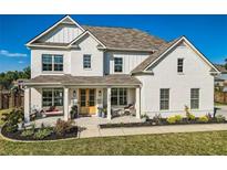 Stunning two-story home featuring a welcoming front porch with elegant columns and a beautifully landscaped yard at 6168 Sweet Birch Ct, Acworth, GA 30101