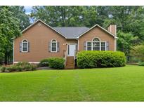 Charming single-Gathering home featuring a well-manicured front yard and cozy design at 48 Saddle Field Nw Cir, Cartersville, GA 30121