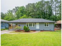 Charming single-story home with a well-maintained lawn and covered entry at 2107 Garden Cir, Decatur, GA 30032