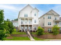 Charming home featuring a brick foundation, two-story porch, and landscaped front yard at 831 Corsiglia Farm Flts, Marietta, GA 30060