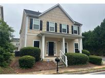 Charming two-story home with black shutters and a well-maintained front yard at 3140 Tylerton Sw Dr, Atlanta, GA 30311