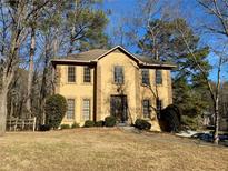Charming two-story home with a well-manicured lawn and a welcoming front entrance at 7592 Watson Kaye, Stone Mountain, GA 30087