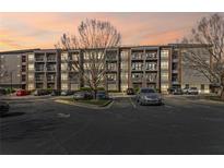 Stylish condo building with balconies, beautiful landscaping, and ample parking for residents and guests at 840 United Avenue Southeast # 401, Atlanta, GA 30312