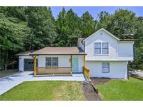 Charming two story home featuring a freshly painted exterior, attached garage and cozy porch at 259 Tarragon Sw Way, Atlanta, GA 30331