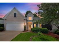 Charming single-Gathering home with attached garage and a well-maintained front yard at sunset at 1335 Seneca, Cumming, GA 30041