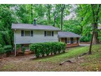 Charming split-level home with lush greenery and well-maintained landscaping at 3294 Francine Dr, Decatur, GA 30033