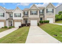Charming townhomes with manicured lawns and individual driveways, providing curb appeal and convenience at 5668 Union Pointe Dr, Union City, GA 30291