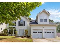 Charming two-story home features a two car garage and manicured landscaping at 4783 Creekside Pl, Decatur, GA 30035