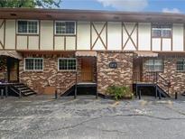 Charming brick exterior of a multi-unit building with private entrances and well-maintained landscaping at 1175 Church St # B, Decatur, GA 30030