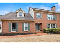 Charming brick home with manicured lawn and a welcoming entrance at 2976 Wilsons Crossing Ct, Decatur, GA 30033