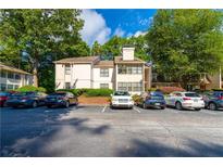 Apartment complex with ample parking and mature trees at 1201 Old Hammond, Atlanta, GA 30350