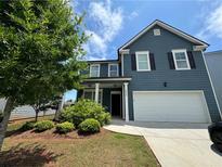 Charming two-story home with a two-car garage and well-maintained landscaping at 3699 Broadwick Ln, Lithonia, GA 30038