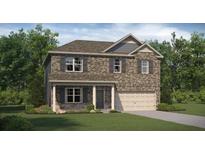 Charming two-story home featuring brick facade, gray shutters, covered entry, and a well-manicured lawn at 1208 Arnhem Dr, Hampton, GA 30228