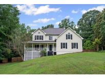 Charming two-story home with a well-manicured lawn and a classic American design at 125 Winter Valley Ct, Fayetteville, GA 30215