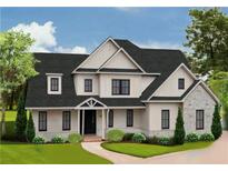Stunning two-story home boasts a modern design with black trim windows and a well-manicured lawn at 301 Eminence Peak, Rydal, GA 30171