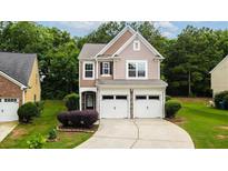 Charming two-story home with a well-maintained lawn, complemented by a two car garage and inviting curb appeal at 162 Ledgewood Mill Way, Lawrenceville, GA 30045