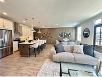 Bright living room featuring an open layout to the kitchen and contemporary decor at 520 Sawnee Village Blvd # D58, Cumming, GA 30040