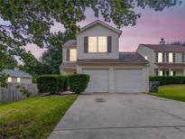 Charming two-story home with a two-car garage, landscaped yard, and inviting curb appeal at 3623 Thurleston Sw Ct, Marietta, GA 30008