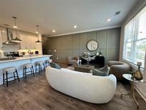 Cozy living room with modern furnishings, wood floors, and natural light at 548 Sawnee Village Blvd # D54, Cumming, GA 30040