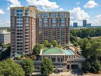 Upscale condominium with community pool and manicured landscaping at 1820 Peachtree Nw St # 811, Atlanta, GA 30309