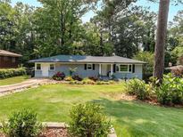 Charming single-story home featuring a well-maintained front yard and inviting curb appeal at 553 Collingwood Dr, Decatur, GA 30032