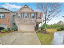 Charming two-story home with brick accents, a two-car garage, and well-maintained landscaping at 2528 Morgan Chase Dr, Buford, GA 30519