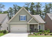 Charming craftsman-style home with a welcoming front porch and attached two-car garage at 3112 Patriot Sw Sq, Marietta, GA 30064