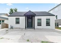 Charming home with a white exterior, black trim, and a covered entry at 3175 Dogwood Dr, Atlanta, GA 30354